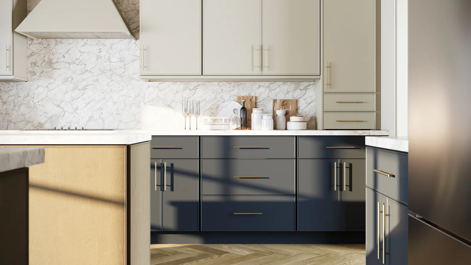 Close view of deep blue lower cabinets, cream upper cabinets and a wood end panel under a marble backsplash