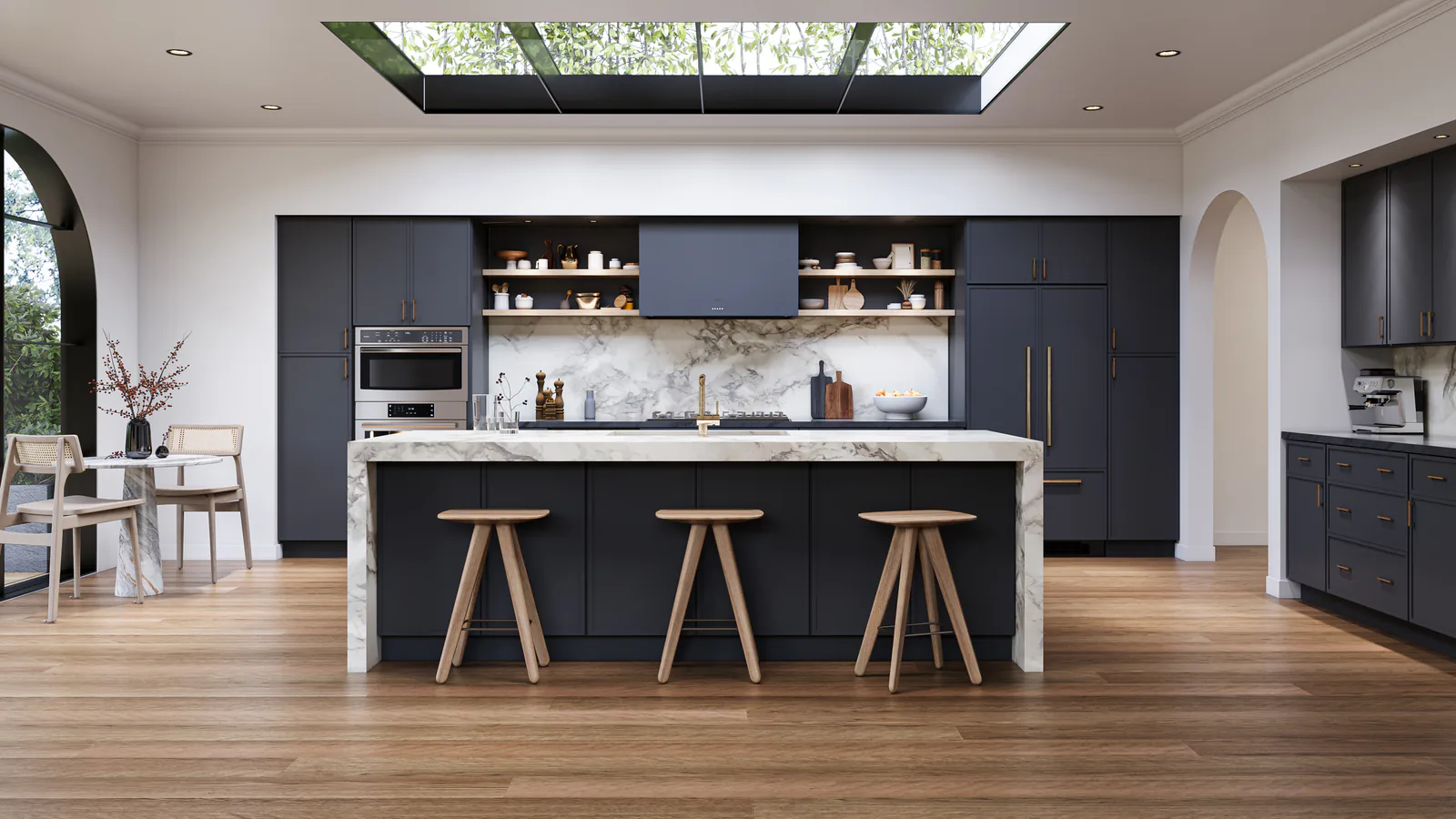 Kitchen with deep blue slim-shaker cabinets, a marble island with wood stools and a skylight above