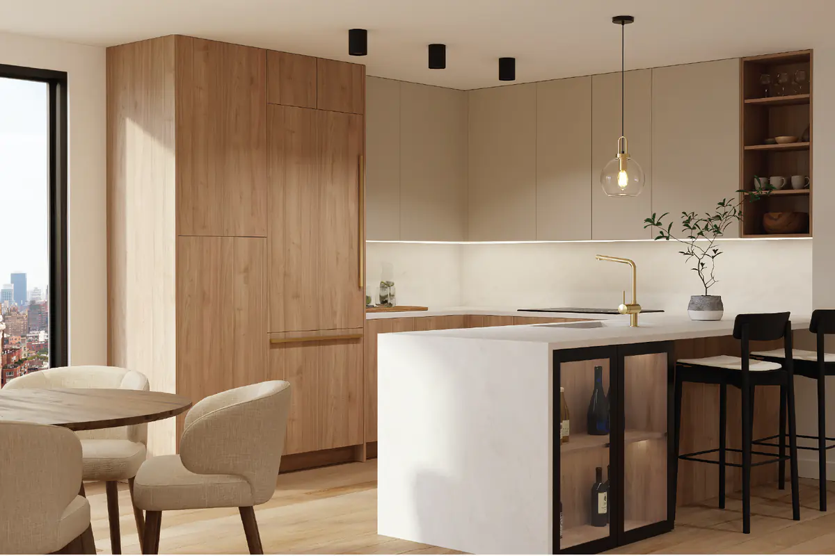 A modern kitchen with tall wood cabinets, flat beige doors and a white waterfall island with black stools