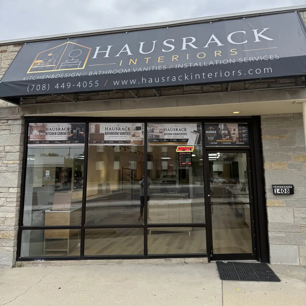 The HausRack Interiors storefront at 1408 W 55th St: a black awning over the shop windows