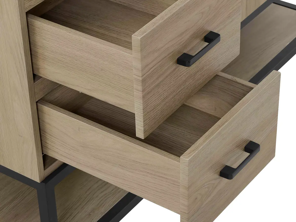 Two open light oak drawers with matte black bar pulls, the corner of the lower drawer front ringed in gold