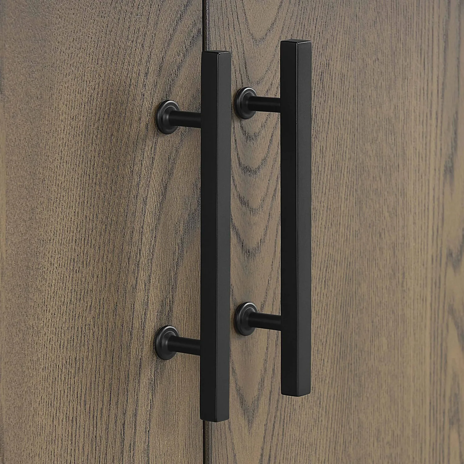 Matte black handle on the vanity antique elm door