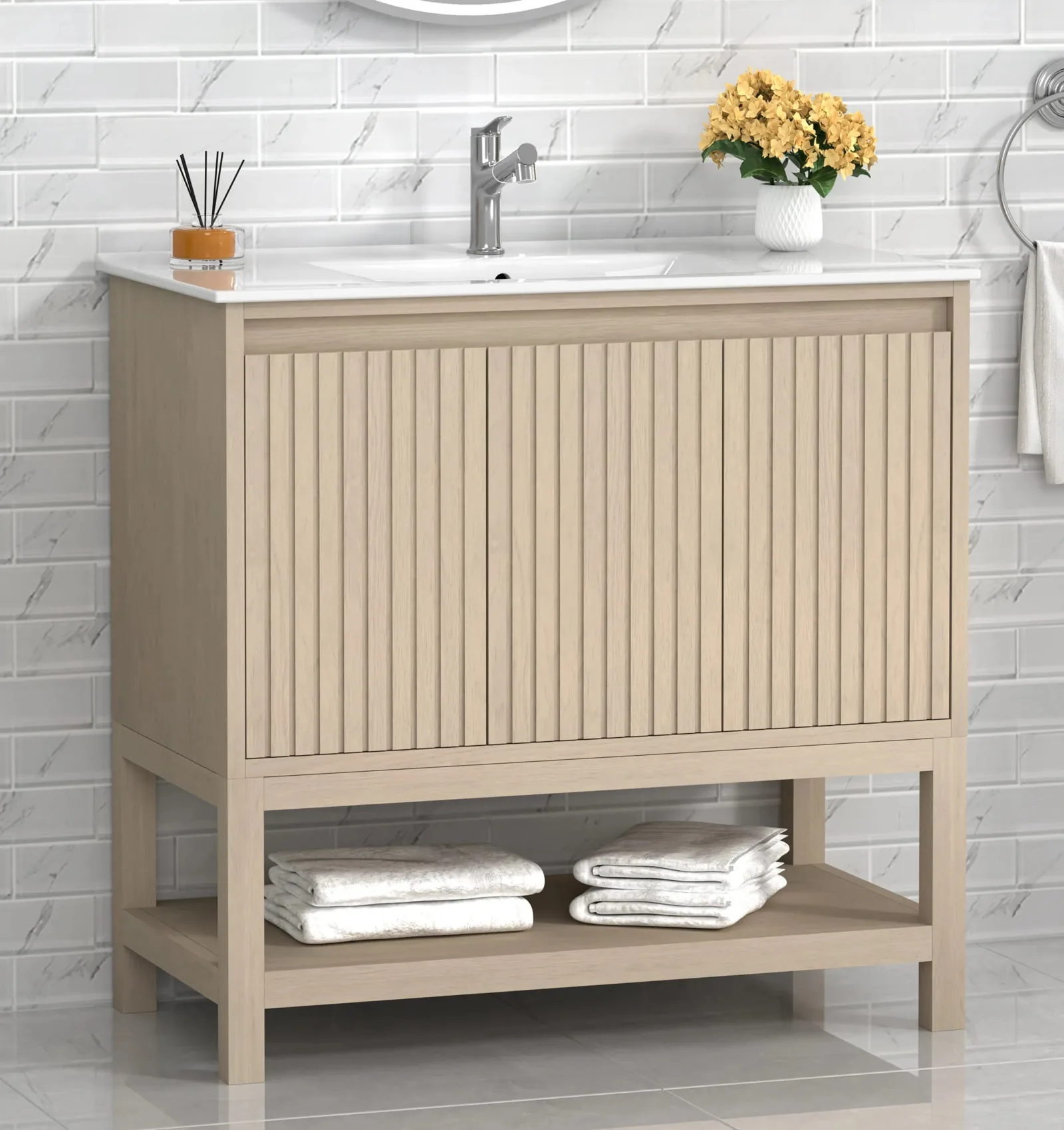 36-inch freestanding bathroom vanity in light oak with fluted doors, open bottom shelf and integrated white porcelain top
