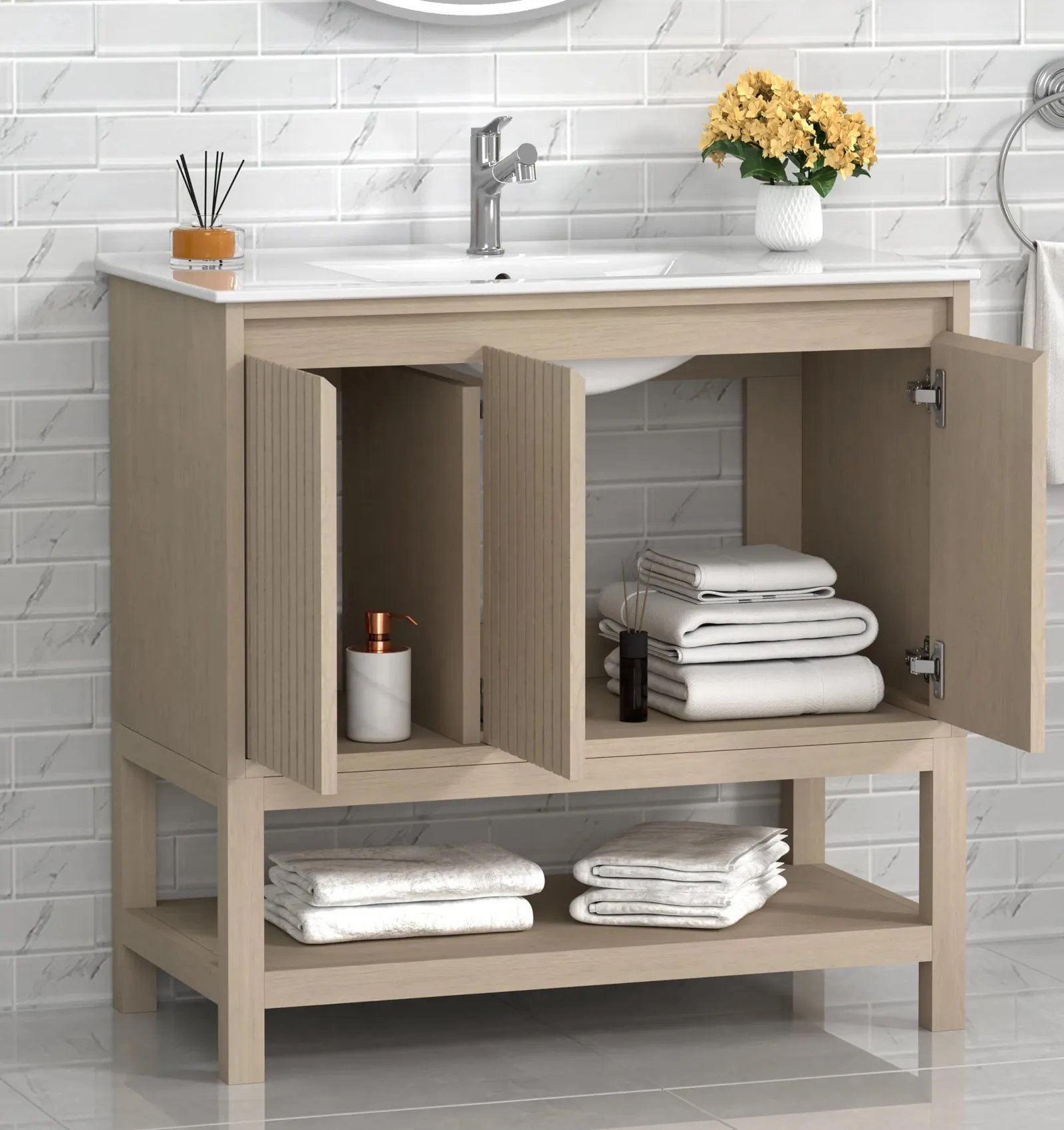 36-inch freestanding vanity with its three soft-close doors open and towels on the open bottom shelf