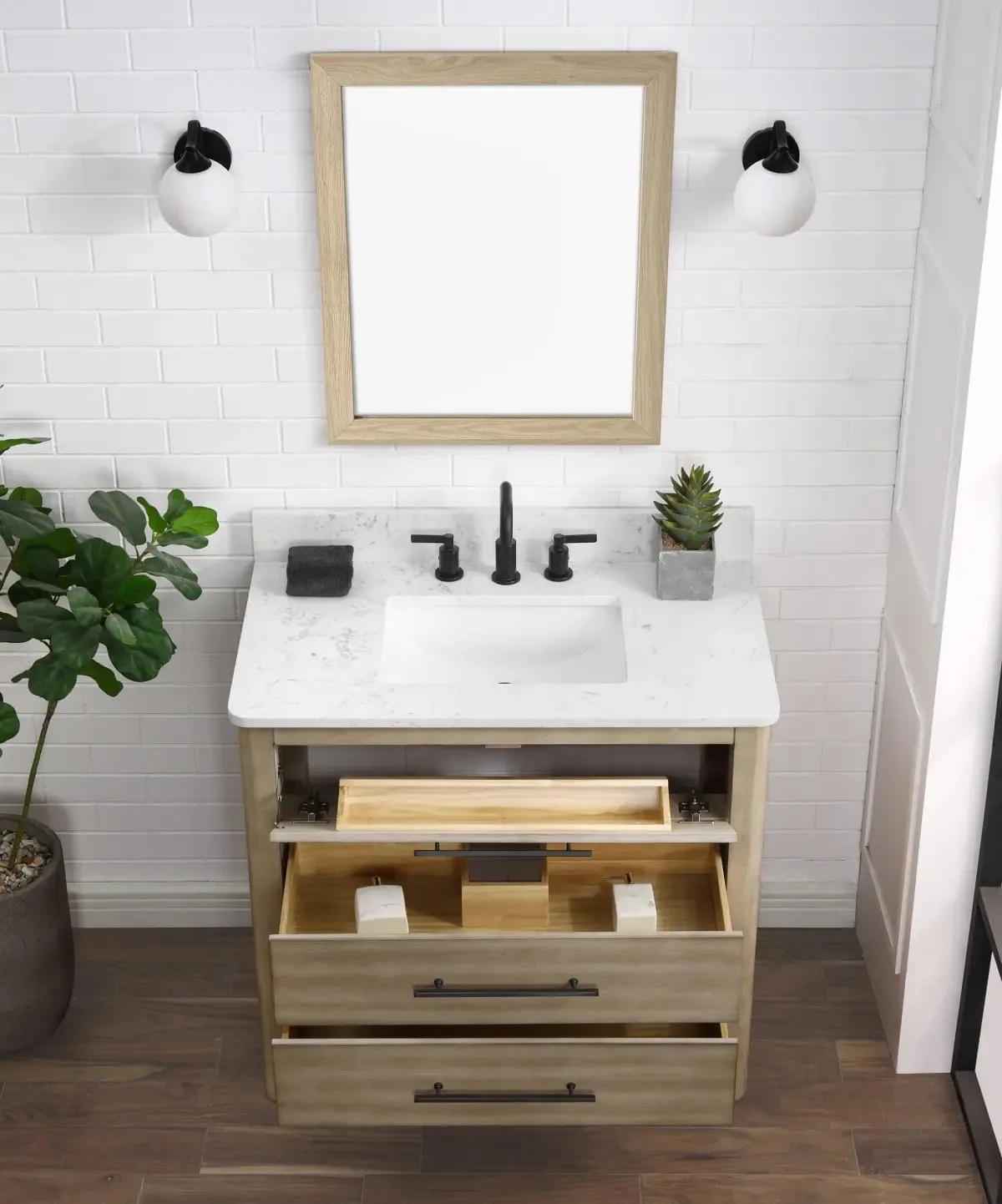 36-inch light wood vanity with drawers open under a Carrara engineered stone top in a bathroom