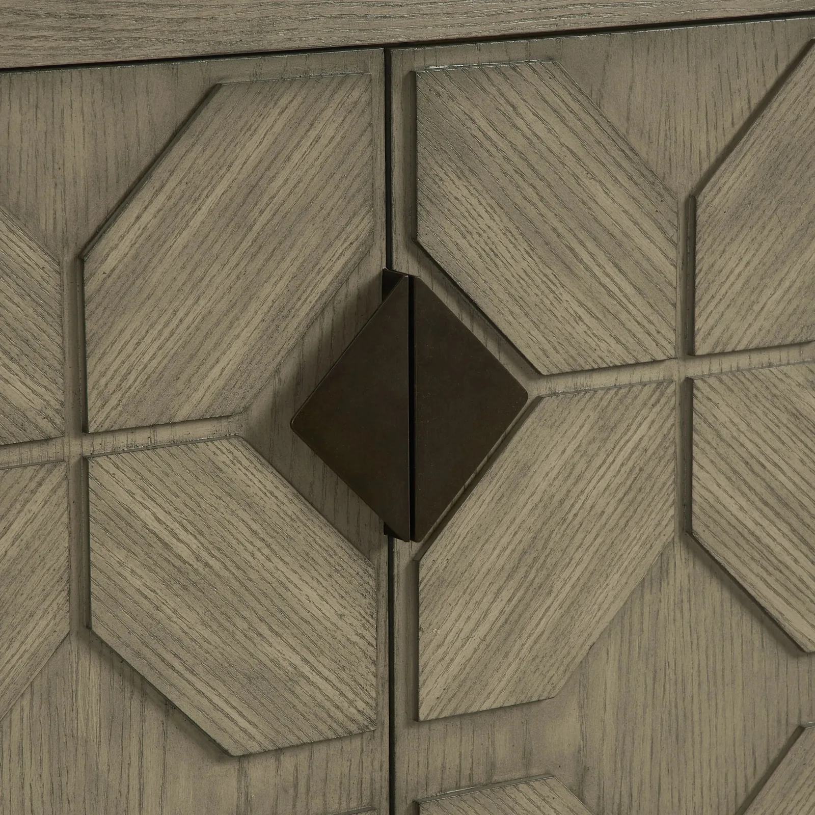 Detail of the gray oak door pattern and diamond-shaped metal pull