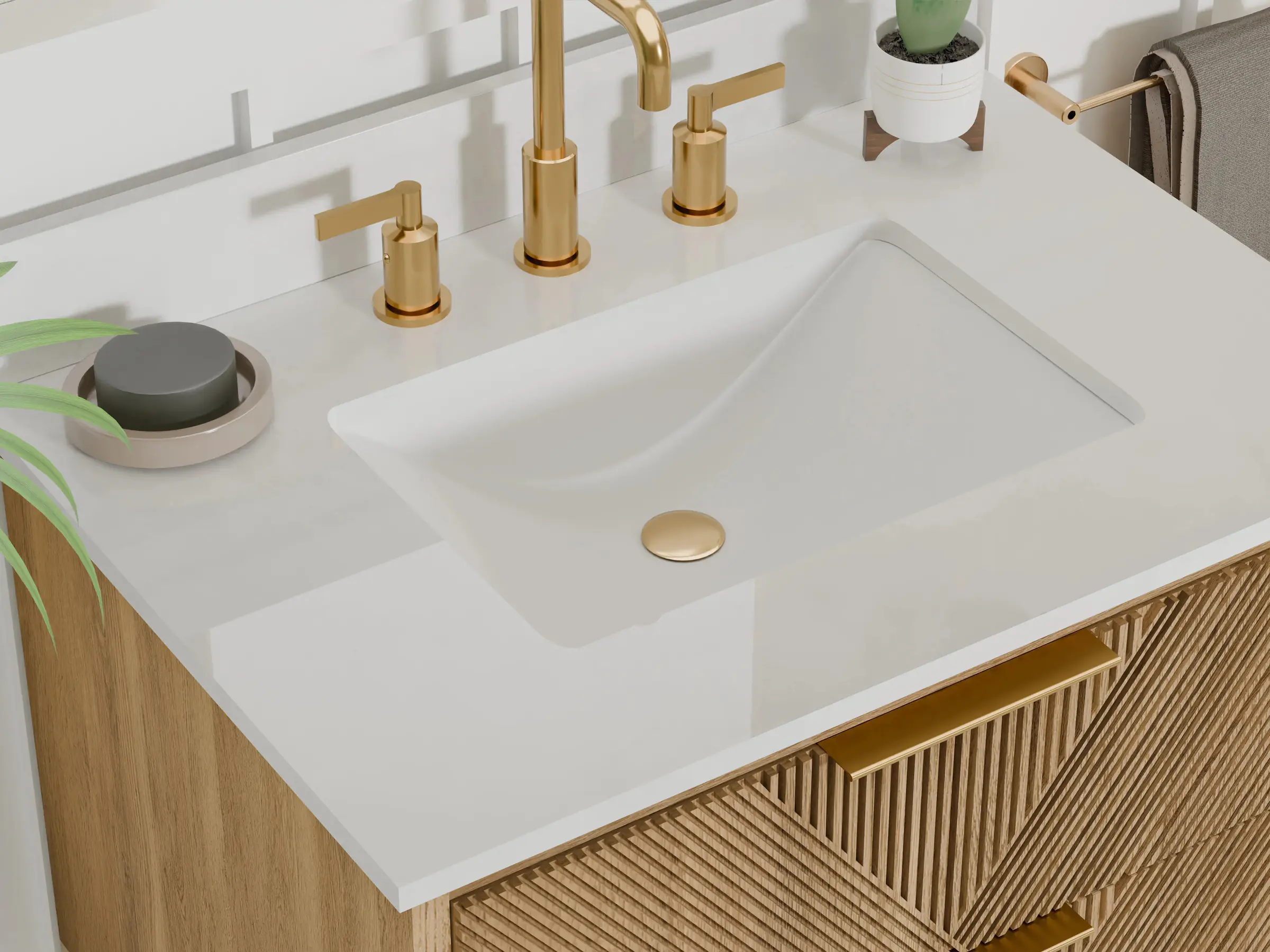 A fluted oak vanity with gold faucets and a white quartz top with an undermount sink