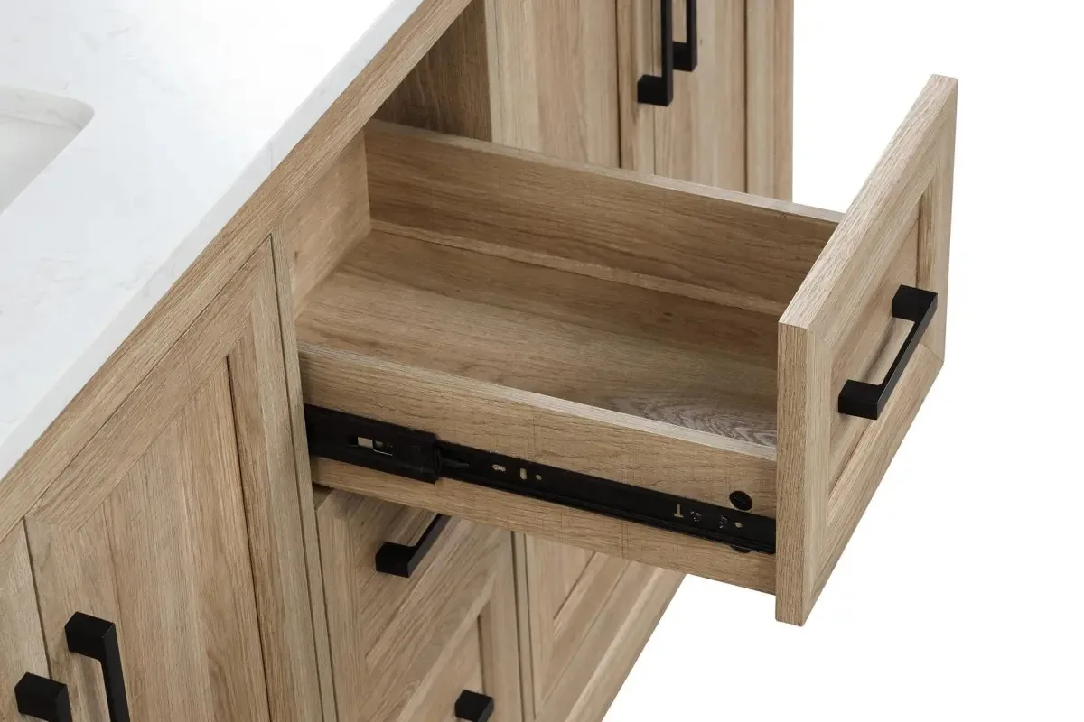 Soft-close drawer pulled open on the light wood vanity