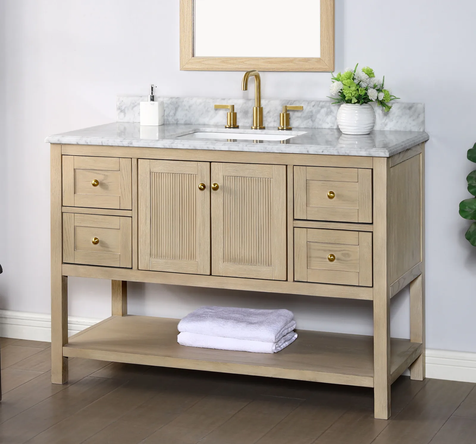 48-inch vanity at an angle, showing the fluted doors, brass knobs and square wood legs