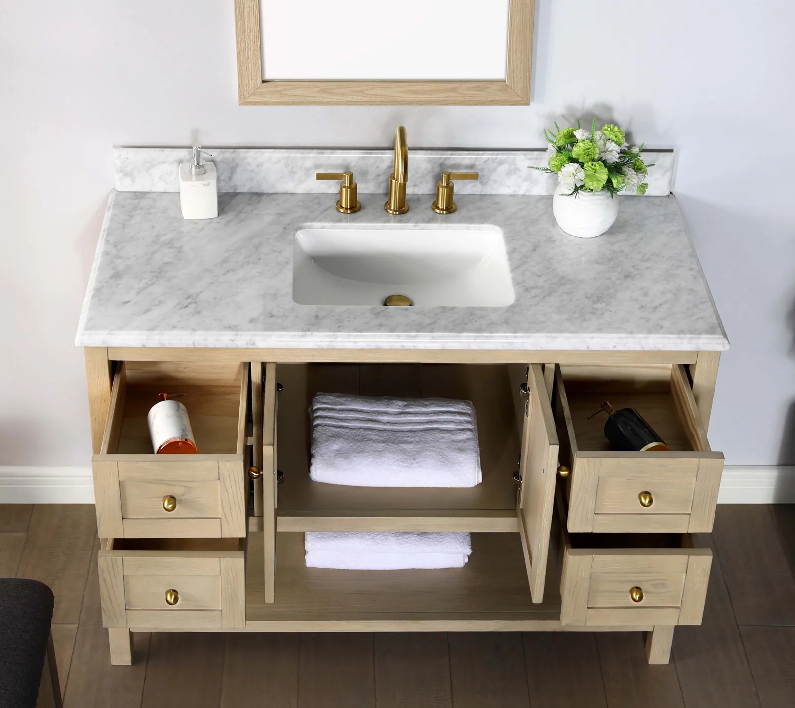48-inch vanity with the doors and drawers open, and the undermount sink in the Carrara top seen from above