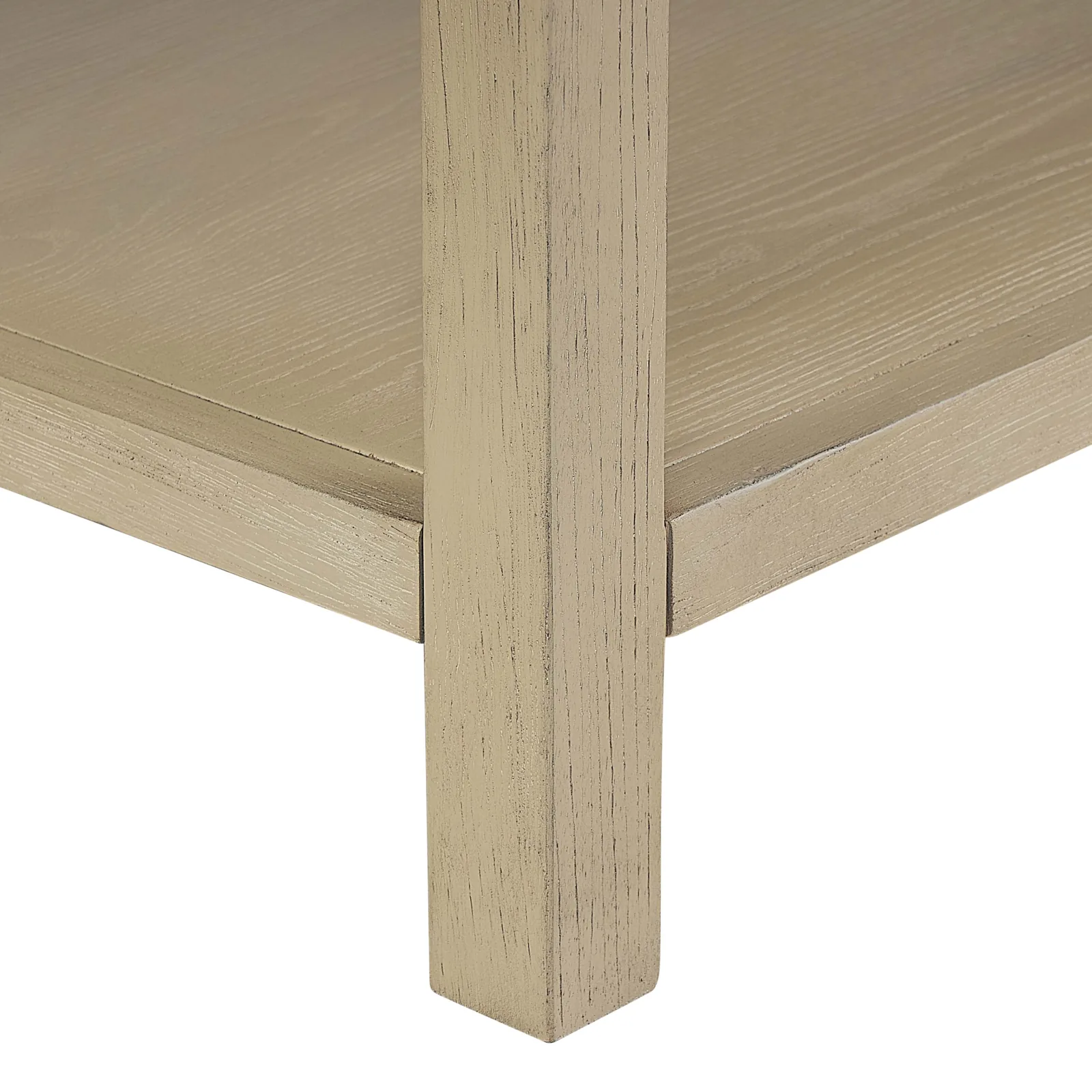 Close-up of a leg and the open lower shelf in the natural wood finish