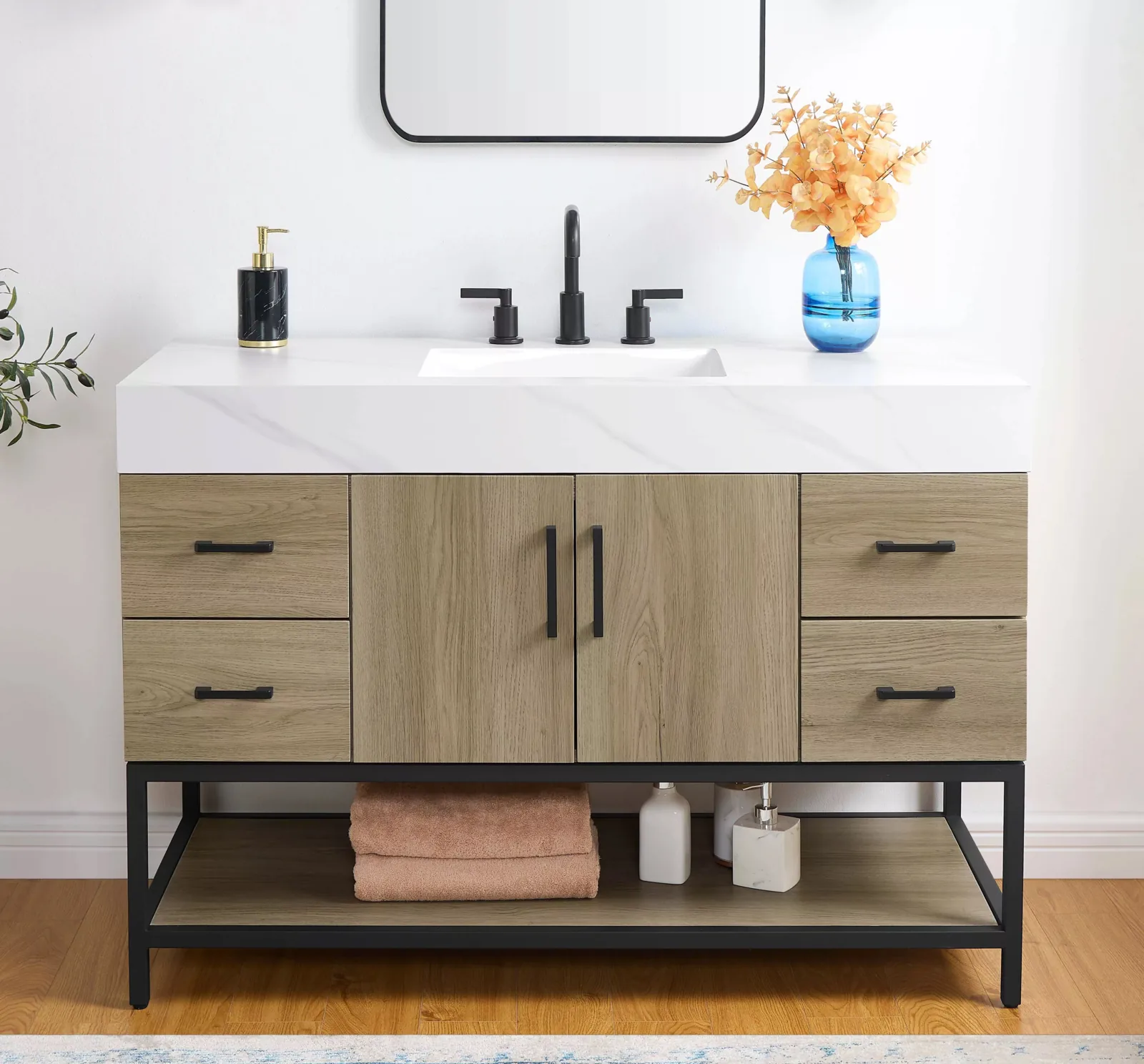 48-inch freestanding bathroom vanity in oak-look finish with Calacatta sintered stone top, matte black handles and black metal frame with open shelf