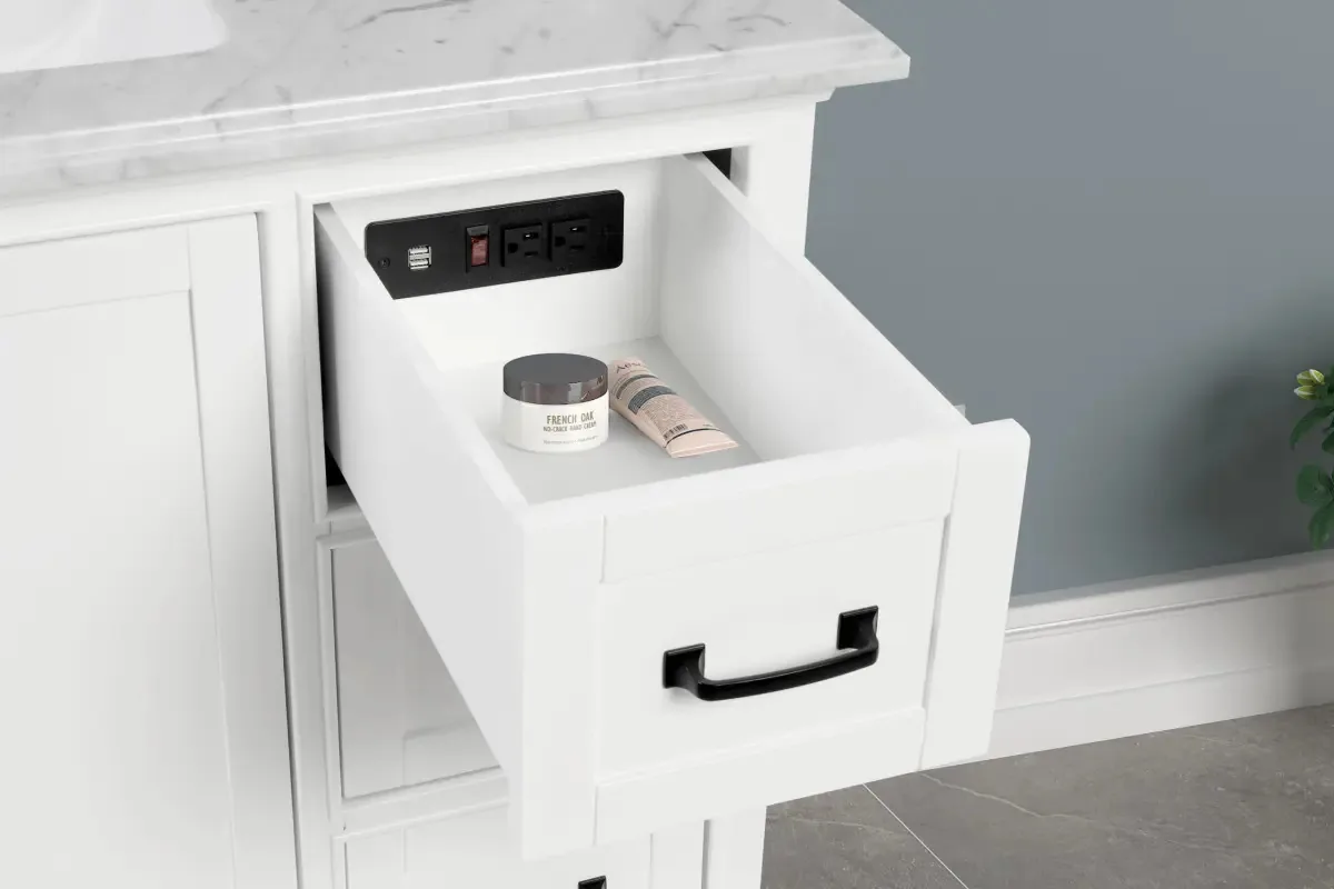 Open drawer on the 36-inch vanity showing the built-in power outlet and USB ports